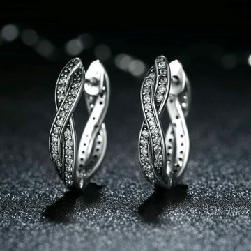 Twisted silver hoop earrings with zircons