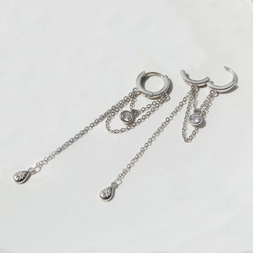 Silver hoop earrings with hanging chains and zircons