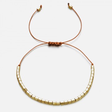 Macrame bracelet with golden beads