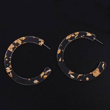 Grandi orecchini a cerchio trasparenti con polvere d'oro