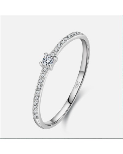 Silver ring paved with zircons and small cubic solitaire