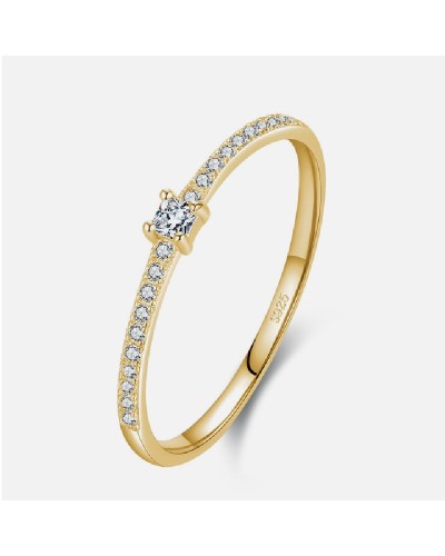 Gold ring paved with zircons and small cubic solitaire