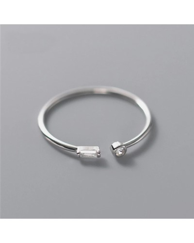 Thin open ring with 2 small silver zircons