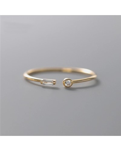 Sottile anello aperto con 2 piccoli zirconi in oro