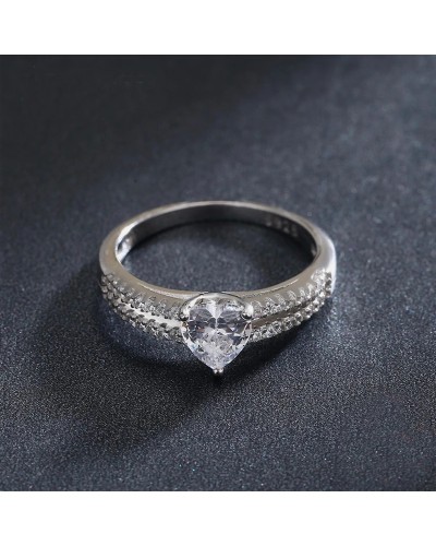 Ring with 2 rings paved with zircons and heart solitaire